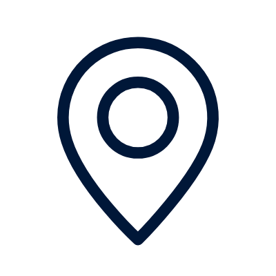 A simple black location pin icon with a circular center on a light gray background.